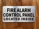The Fire Alarm Control Panel Located Inside Compliance Sign