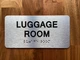 The Luggage Room with Raised Letters & Grade 2 Compliance Sign