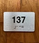 Apartment number 137 Braille Sign