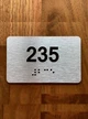 Apartment number 235 Braille Sign