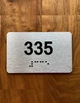 Apartment number 335 Braille Sign