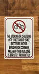 the-storing-or-charging-of-e-bikes-and-e-bikes-batteries-sign-metal-wall-sign-7-x-10-inches.jpg