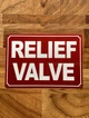 relief-valve-sign-7-x-10-inches-mounting-holes.jpg
