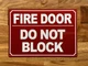 fire-door-do-not-block-sign-10-x-12-inches-mounting-holes.jpg