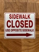 sidewalk-closed-use-opposite-sidewalk-arrow-right-sign-10-x-12-inches-mounting-holes.jpg