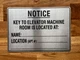 notice-key-to-elevator-machine-room-is-located-at-self-adhesive-metal-sign.jpg