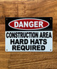 danger-construction-area-hard-hat-required-white-safety-sign.jpg