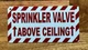 sprinkler-valve-above-ceiling-3x6-building-signage.jpg