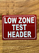 low-zone-test-header-red-safety-sign.jpg