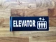 elevator-hallway-black-safety-sign.jpg
