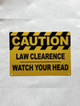5x7-caution-law-clearence-watch-your-head-orange-metal-identification-sign.jpg