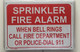 SPRINKLER FIRE ALARM WHEN BELL RINGS CALL 911   BUILDING SIGN