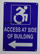 Sign Access at Side of Building Left Arrow -The Pour Tous Blue LINE