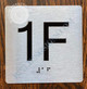 Apartment Number 1F Sign with Braille and Raised Number