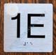 Apartment Number 1E Sign with Braille and Raised Number