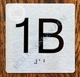 Apartment Number 1B Sign with Braille and Raised Number