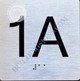 Apartment Number 1A Signage with Braille and Raised Number