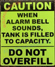 The "Caution When Alarm Bell Sounds, Tank is Filled to Capacity" sign is a type of safety sign used to warn people about the potential danger of an overfilled tank. This type of sign is typically used in facilities that store large amounts of liquids or other materials in tanks, such as chemical plants, oil refineries, and industrial storage facilities.

When a tank is filled to capacity, there is a risk of overflow or other safety hazards. To help prevent accidents and protect people, many tanks are equipped with an alarm system that sounds an alarm bell when the tank is filled to capacity.

The "Caution When Alarm Bell Sounds, Tank is Filled to Capacity" sign serves as a warning to people in the area that the alarm bell indicates a potential safety hazard and that they should take precautions, such as evacuating the area or taking other appropriate action. The sign typically displays the words "Caution When Alarm Bell Sounds, Tank is Filled to Capacity" along with an illustration or symbol to emphasize the message.

In conclusion, the "Caution When Alarm Bell Sounds, Tank is Filled to Capacity" sign is an important component of safety in facilities that store liquids or other materials in tanks. By warning people about the potential danger of an overfilled tank, the sign helps to ensure that people are prepared to respond in case of an emergency and can help to prevent accidents.