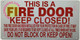 THIS IS A FIRE DOOR KEEP CLOSED Signage