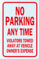 NO PARKING ANY TIME VIOLATORS TOWED AWAY AT VEHICLE OWNER'S EXPENSE Signage