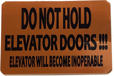 DO NOT HOLD ELEVATOR DOORS ELEVATOR WILL BECOME INOPERABLE SIGN