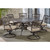 Traditions 7-Piece Dining Set with a 60 In. Round Cast-top Table and Six Swivel Rockers