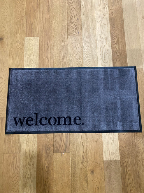 Grey mat with a black welcome