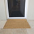 Front on image of a large 55 x 90cm door mat made from coir