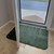 Low profile door mat with door mat opening over it