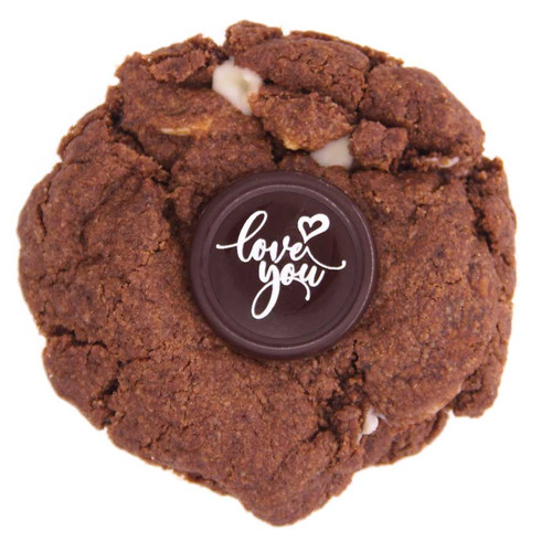 vegan and gluten free triple chocolate cookie with chocolate message topping