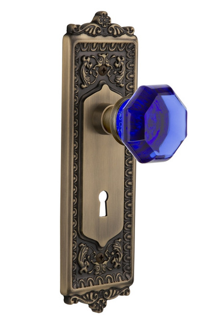 Nostalgic Warehouse - Egg & Dart Plate with Keyhole Passage Waldorf Cobalt Door Knob in Antique Brass - EADWAC - 721568 - 2 3/8" Backset