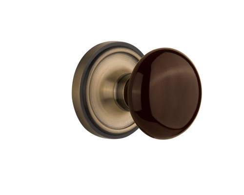 Nostalgic Warehouse - Classic Rosette Interior Mortise Brown Porcelain Door Knob in Antique Brass - CLABRN - 710824 - 2 1/4" Backset