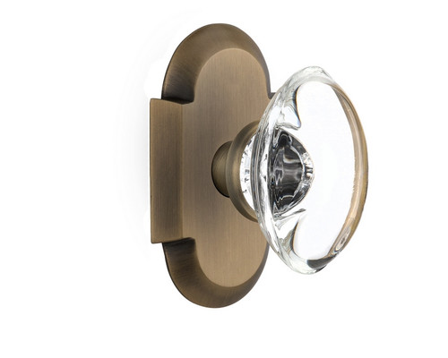 Nostalgic Warehouse - Cottage Plate Passage Oval Clear Crystal Glass Door Knob in Antique Brass - COTOCC - 708572 - 2 3/4" Backset