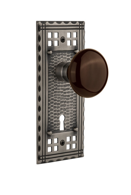 Nostalgic Warehouse - Craftsman Plate with Keyhole Passage Brown Porcelain Door Knob in Antique Pewter - CRABRN - 715331 - 2 3/8" Backset