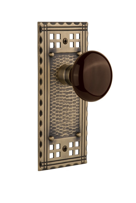 Nostalgic Warehouse - Craftsman Plate Single Dummy Brown Porcelain Door Knob in Antique Brass - CRABRN - 715394