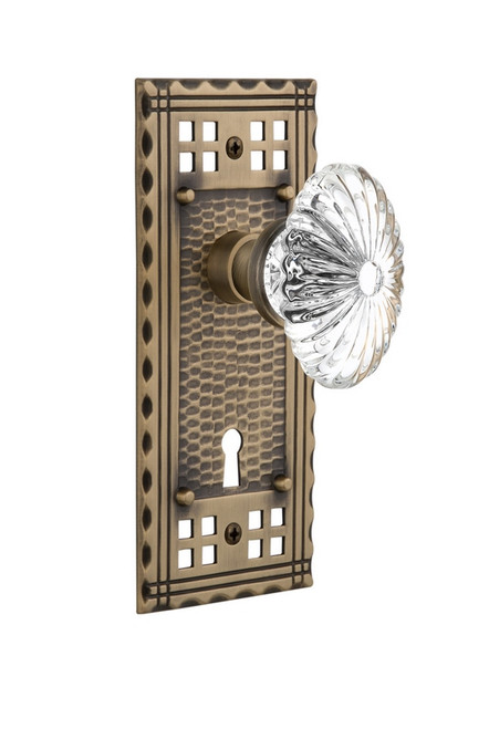 Nostalgic Warehouse - Craftsman Plate with Keyhole Privacy Oval Fluted Crystal Glass Door Knob in Antique Brass - CRAOFC - 715722 - 2 3/8" Backset