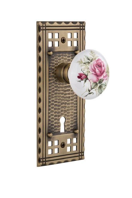 Nostalgic Warehouse - Craftsman Plate with Keyhole Privacy White Rose Porcelain Door Knob in Antique Brass - CRAROS - 715726 - 2 3/8" Backset