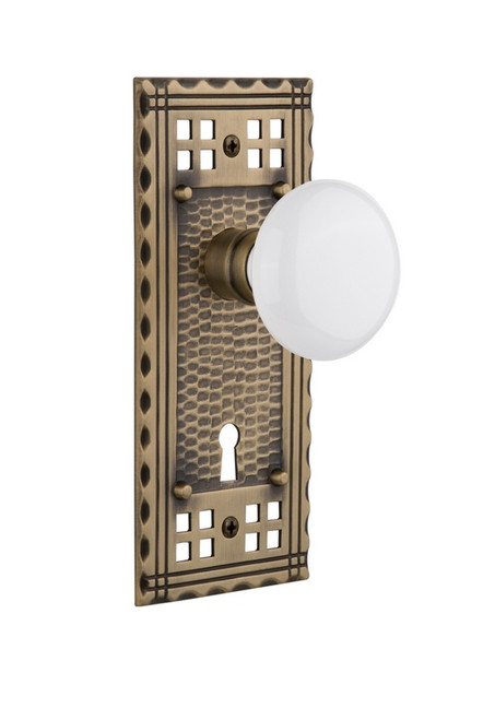 Nostalgic Warehouse - Craftsman Plate with Keyhole Privacy White Porcelain Door Knob in Antique Brass - CRAWHI - 715706 - 2 3/8" Backset