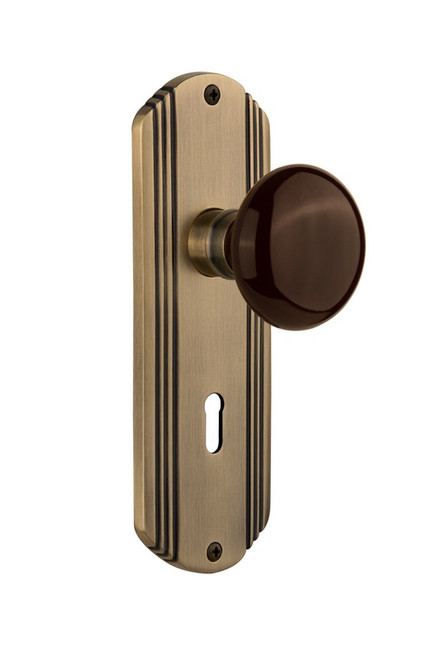 Nostalgic Warehouse - Deco Plate with Keyhole Passage Brown Porcelain Door Knob in Antique Brass - DECBRN - 710276 - 2 3/4" Backset