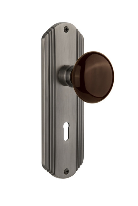 Nostalgic Warehouse - Deco Plate with Keyhole Passage Brown Porcelain Door Knob in Antique Pewter - DECBRN - 710280 - 2 3/4" Backset