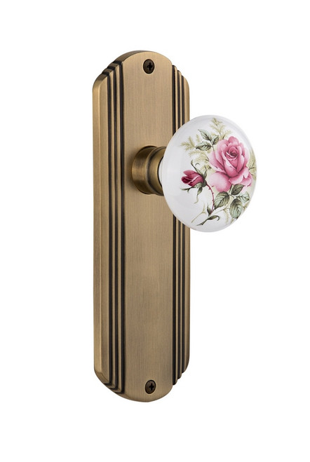 Nostalgic Warehouse - Deco Plate Passage White Rose Porcelain Door Knob in Antique Brass - DECROS - 708834 - 2 3/4" Backset
