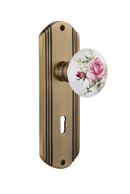 Nostalgic Warehouse - Deco Plate Interior Mortise White Rose Porcelain Door Knob in Antique Brass - DECROS - 706752 - 2 1/4" Backset