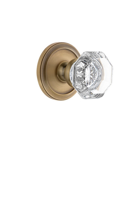 Grandeur Hardware - Circulaire Rosette Passage with Chambord Crystal Knob in Vintage Brass - CIRCHM - 809807