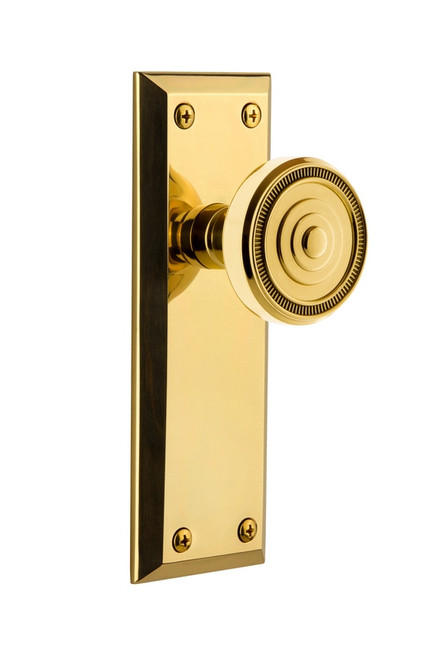 Grandeur Hardware - Fifth Avenue Plate Privacy with Soleil Knob in Polished Brass - FAVSOL - 808112