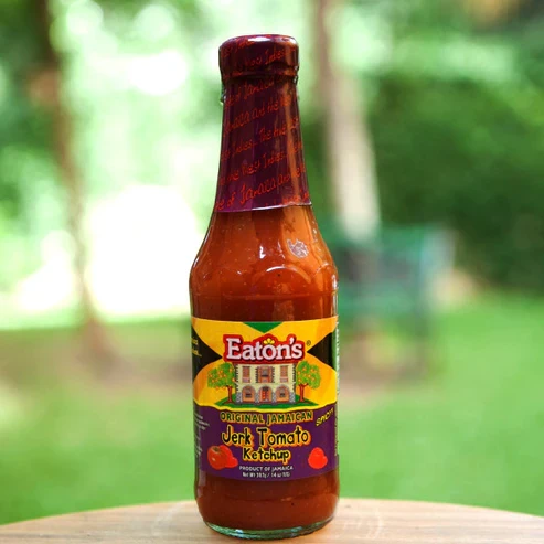 Turn up the flavor with Eaton's Original Jamaican Jerk Tomato Ketchup! This rich, thick tomato ketchup is infused with authentic Jamaican jerk seasoning, delivering the perfect balance of sweet, tangy, and spicy flavors. Ideal for burgers, sandwiches, fries, chicken, sausages, and grilled meats, it also makes a delicious dipping sauce or marinade enhancer. Add a bold Jamaican twist to your favorite meals with every squeeze.