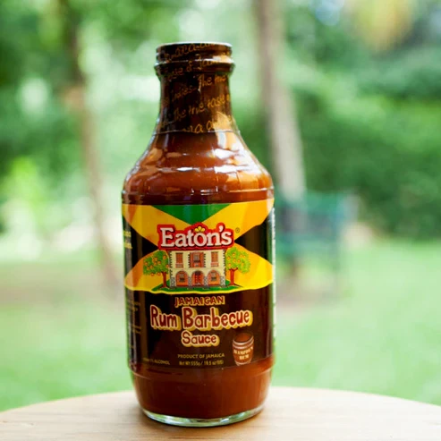 Enjoy the rich, smoky flavor of Eaton's Rum BBQ Sauce! Infused with the distinctive taste of rum, this delicious barbecue sauce offers the perfect balance of sweet, tangy, and smoky notes. Ideal for marinating, glazing, basting, or dipping, it pairs perfectly with chicken, pork, beef, seafood, and grilled vegetables. Add a bold Caribbean-inspired touch to your favorite dishes with Eaton's Rum BBQ Sauce.