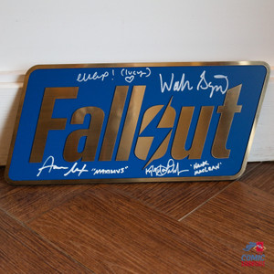 Fallout signed plaque featuring autographs from Ella Purnell, Aaron Moten, Walton Goggins, and Kyle MacLachlan. Flat brushed-brass style collectible inspired by the Fallout series.