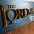 Mounted Lord of the Rings signed plaque displayed as a premium collector’s piece. Features 3D title lettering and signatures from key LOTR cast members.