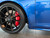 Side view of 991 Porsche 911 with front low mount 1FastGuard stone guards