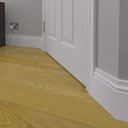 Skirting World Elegance MDF Skirting Board, white decorative skirting at the base of a wall next to a wooden floor.